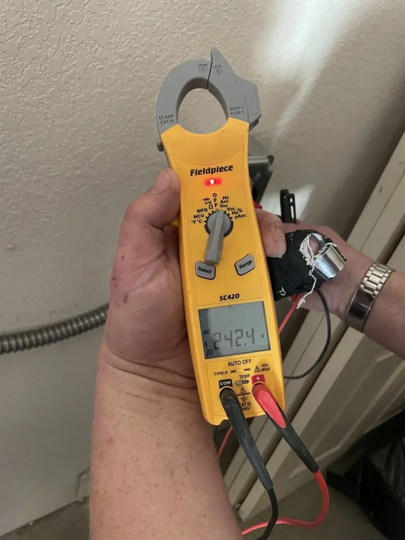 Voltage testing with clamp meter during Outlet Installation in Townsend